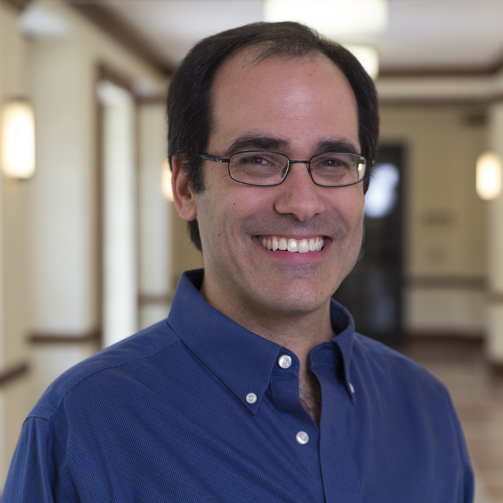 Photo of Richard Swartz smiling in a blue shirt.