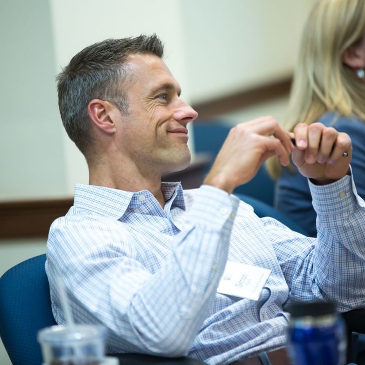 Man sitting in a leadership development Rice Business Executive Education program