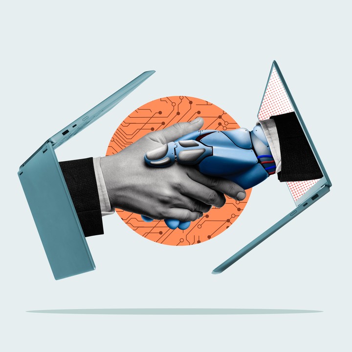 Illustration of human and robot hands emerging from laptops in a handshake