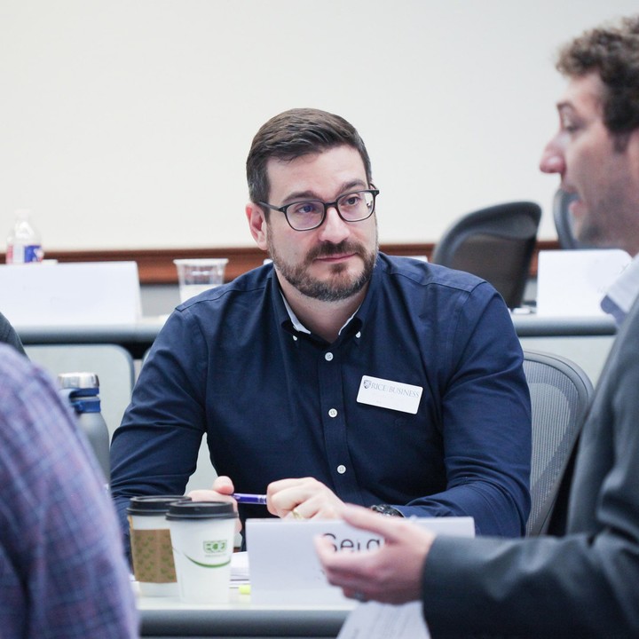 Group of Rice Executive Education particpants studying together 